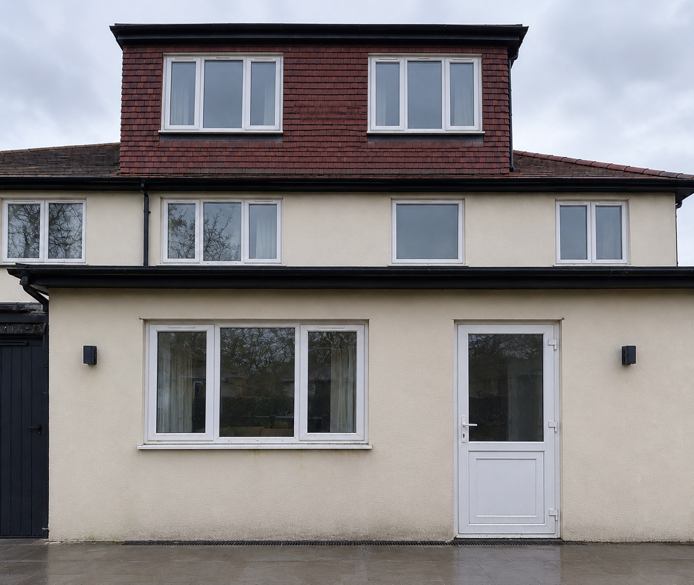 Before: cream house with white uPVC windows and door